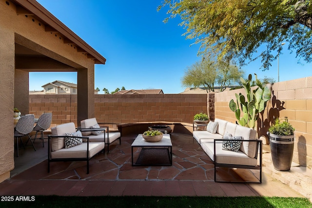 view of patio / terrace featuring outdoor lounge area and a fenced backyard