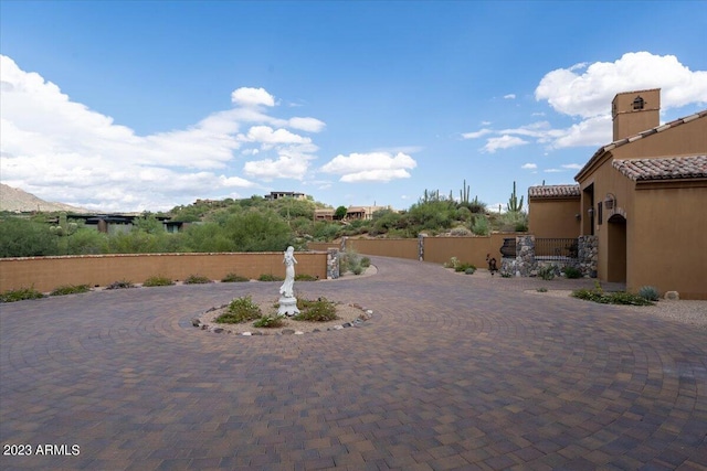 9514 E Madera Dr, Scottsdale, AZ 85262 - view of yard with curved driveway and fence