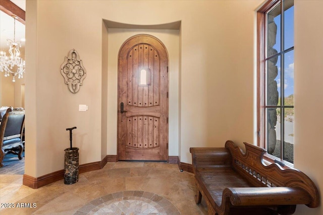 9514 E Madera Dr, Scottsdale, AZ 85262 - foyer entrance with a notable chandelier and baseboards