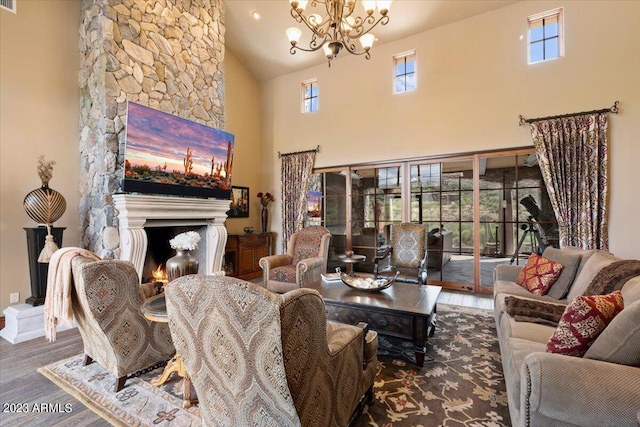 9514 E Madera Dr, Scottsdale, AZ 85262 - living area featuring wood finished floors, an inviting chandelier, a fireplace, and high vaulted ceiling