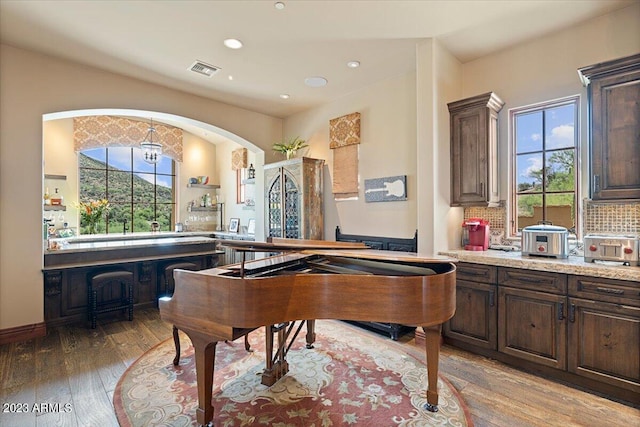 9514 E Madera Dr, Scottsdale, AZ 85262 - recreation room with recessed lighting, arched walkways, light wood-style flooring, and visible vents