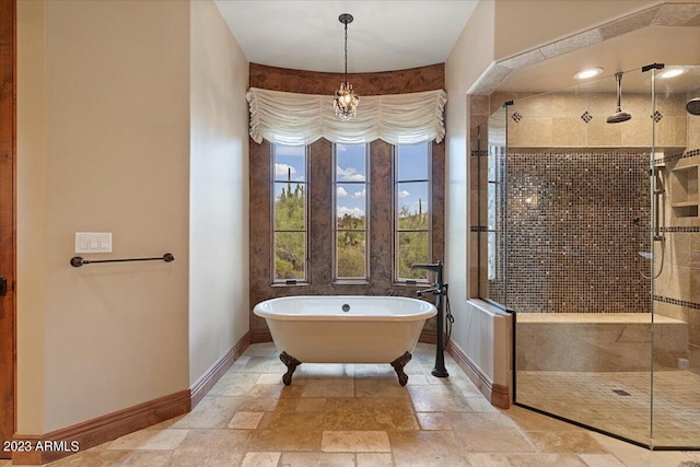 9514 E Madera Dr, Scottsdale, AZ 85262 - full bathroom featuring a freestanding bath, a shower stall, stone tile floors, and baseboards