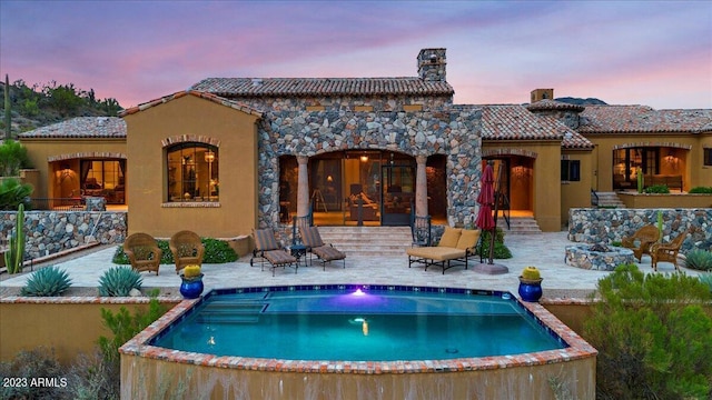 9514 E Madera Dr, Scottsdale, AZ 85262 - back of house with stucco siding, a patio, a tile roof, an outdoor pool, and a chimney