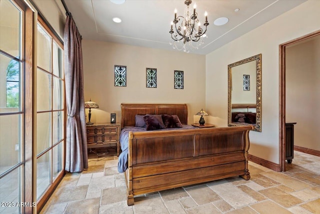 9514 E Madera Dr, Scottsdale, AZ 85262 - bedroom with a chandelier, stone tile floors, and baseboards