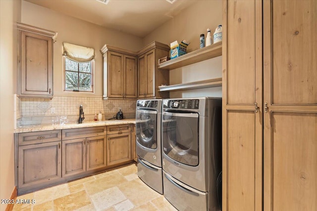 9514 E Madera Dr, Scottsdale, AZ 85262 - clothes washing area featuring stone finish flooring, washer and dryer, a sink, and cabinet space