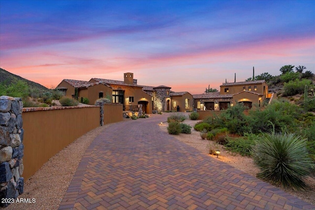 9514 E Madera Dr, Scottsdale, AZ 85262 - view of front of home with a tiled roof, curved driveway, fence, and stucco siding