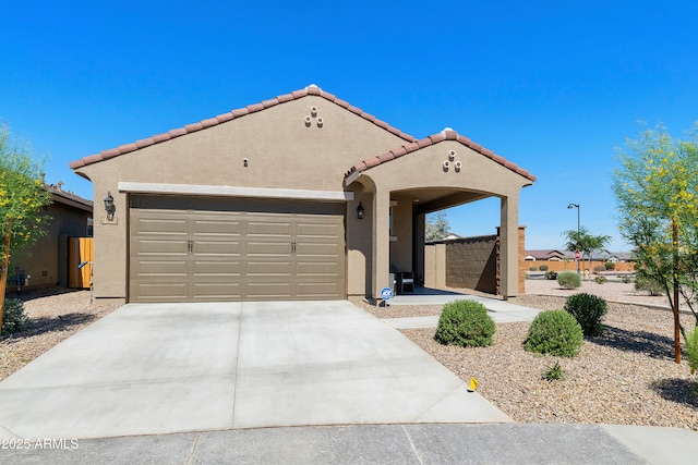 21690 N Lynn St, Maricopa, AZ 85138 - mediterranean / spanish home featuring stucco siding, driveway, a tile roof, and an attached garage