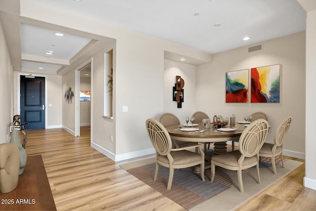 dining room featuring recessed lighting, light wood finished floors, visible vents, and baseboards