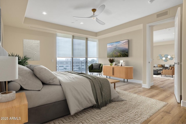 bedroom with baseboards, recessed lighting, visible vents, access to exterior, and light wood finished floors