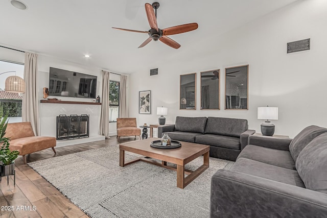 5602 W Alameda Rd, Glendale, AZ 85310 - living area featuring a ceiling fan, wood finished floors, a large fireplace, and recessed lighting