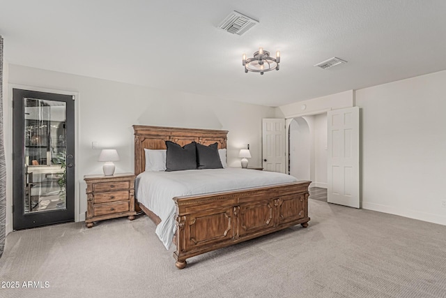 5602 W Alameda Rd, Glendale, AZ 85310 - bedroom featuring light colored carpet, arched walkways, and baseboards
