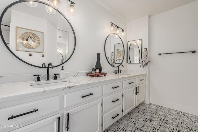 5602 W Alameda Rd, Glendale, AZ 85310 - bathroom with double vanity and baseboards