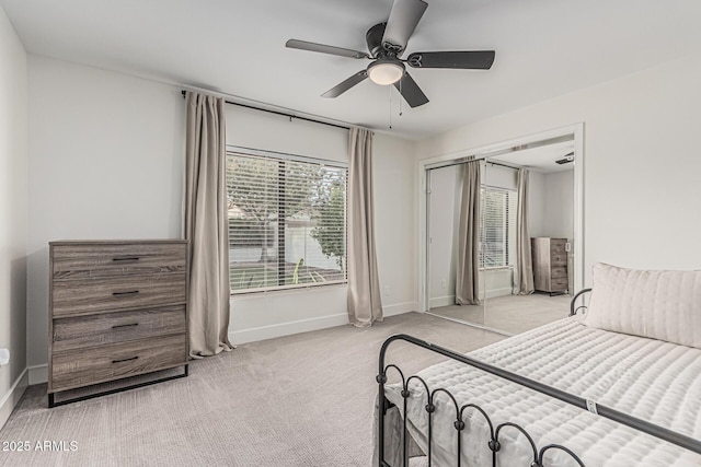 5602 W Alameda Rd, Glendale, AZ 85310 - bedroom featuring baseboards, light carpet, ceiling fan, and a closet