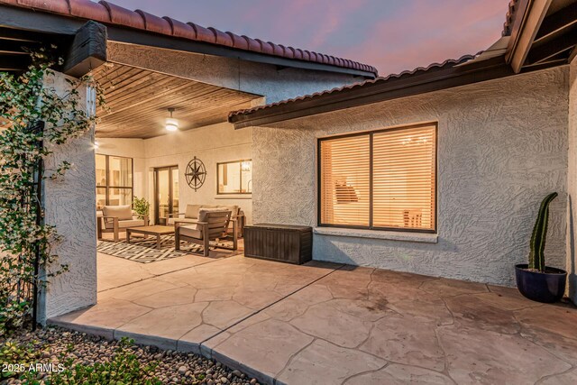 5602 W Alameda Rd, Glendale, AZ 85310 - patio terrace at dusk featuring an outdoor living space