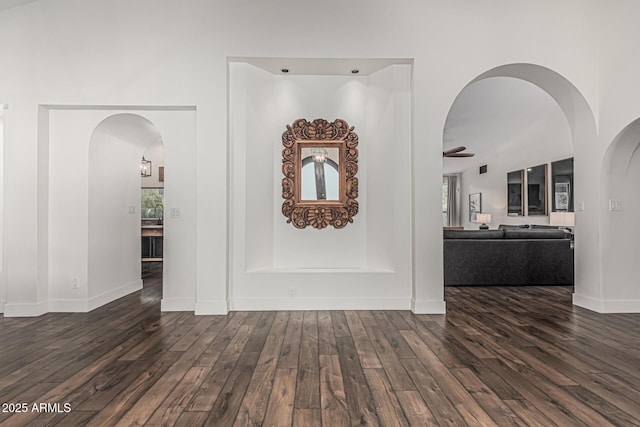 5602 W Alameda Rd, Glendale, AZ 85310 - corridor featuring dark wood-style floors, arched walkways, and baseboards