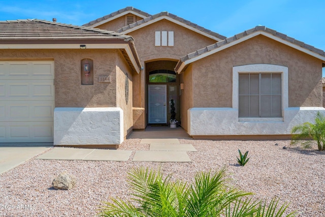 1144 E Nunneley Rd, Gilbert, AZ 85296 - view of front of home with stucco siding and a garage