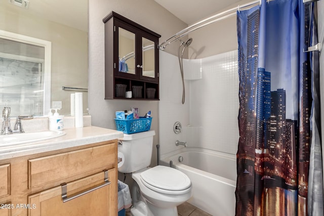 bathroom with toilet, visible vents, vanity, tile patterned floors, and shower / bath combo with shower curtain