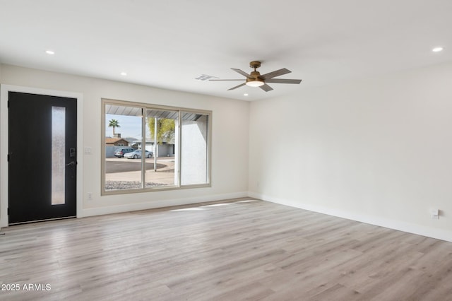 unfurnished room featuring recessed lighting, visible vents, light wood-style floors, a ceiling fan, and baseboards