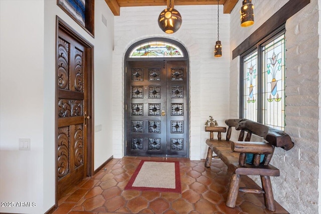 entryway with beam ceiling