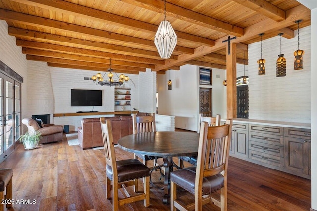 dining space with beamed ceiling, a chandelier, hardwood / wood-style flooring, and wooden ceiling