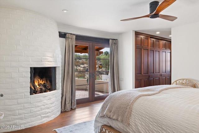 bedroom with ceiling fan, light hardwood / wood-style flooring, access to outside, and french doors