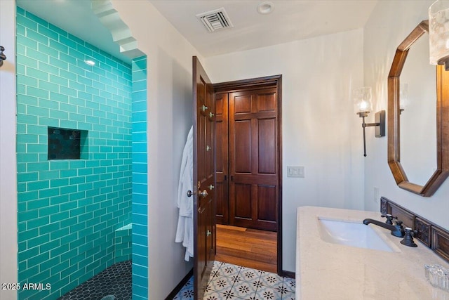 bathroom featuring vanity and walk in shower