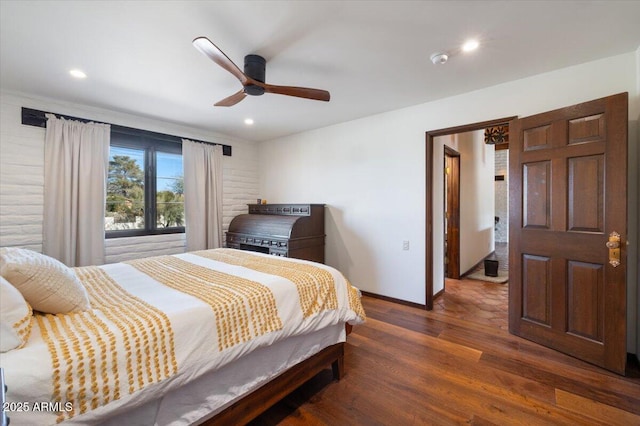 bedroom featuring ceiling fan and dark wood-type flooring