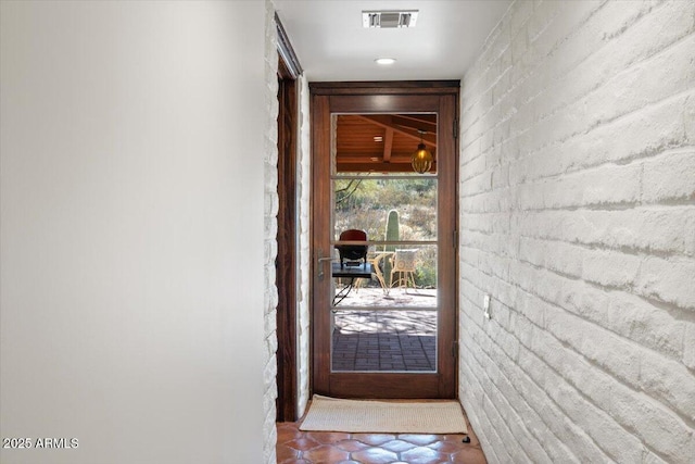 doorway with brick wall