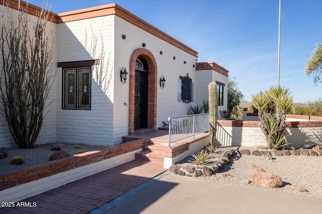 mediterranean / spanish-style house with covered porch