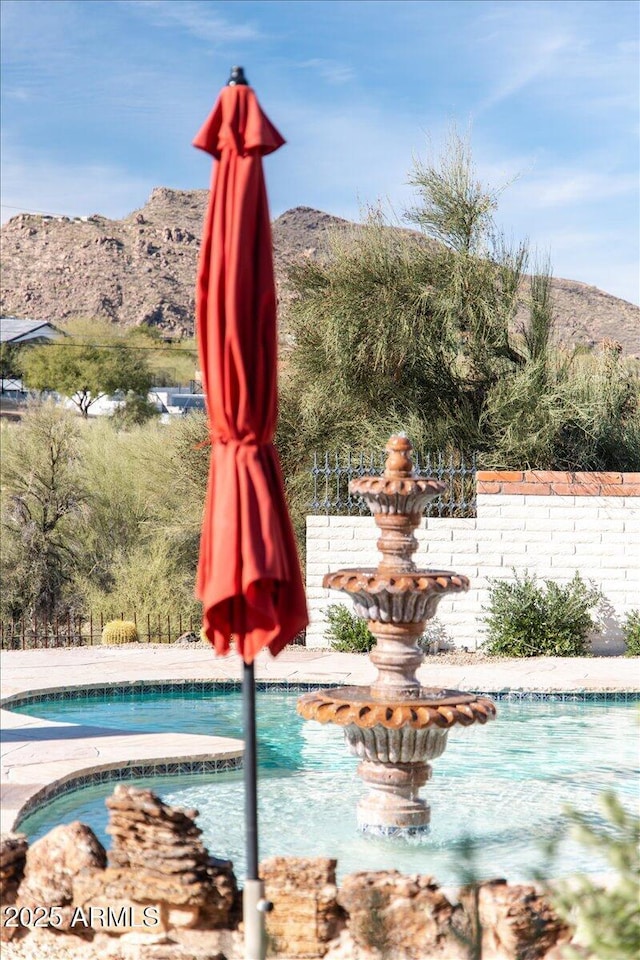 view of pool with a mountain view