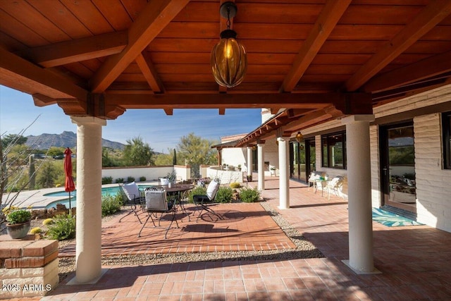 view of patio / terrace with a mountain view