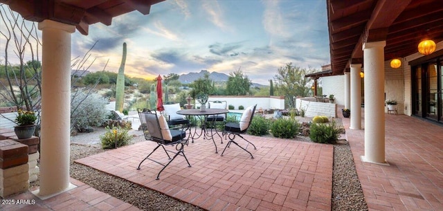 view of patio terrace at dusk