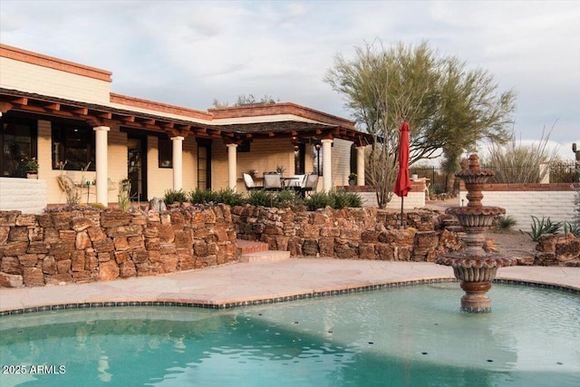 view of pool featuring a patio area