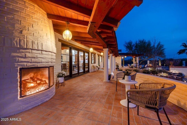 view of patio featuring an outdoor fireplace