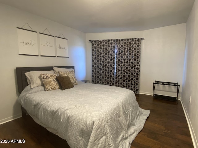 bedroom featuring dark hardwood / wood-style flooring