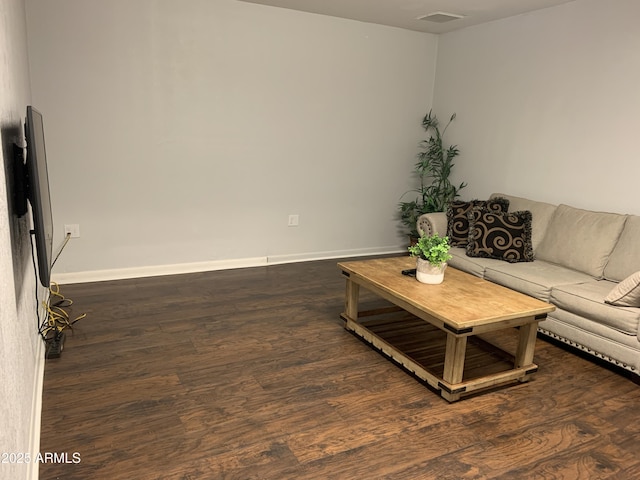 living room with dark hardwood / wood-style floors