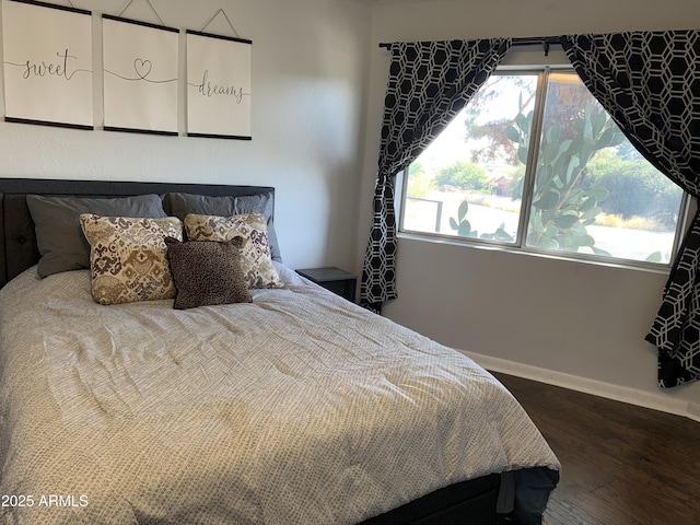 bedroom featuring dark hardwood / wood-style flooring