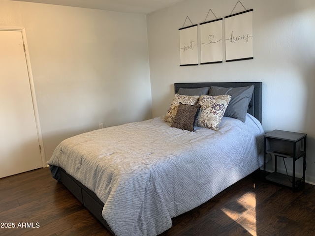 bedroom featuring dark hardwood / wood-style flooring