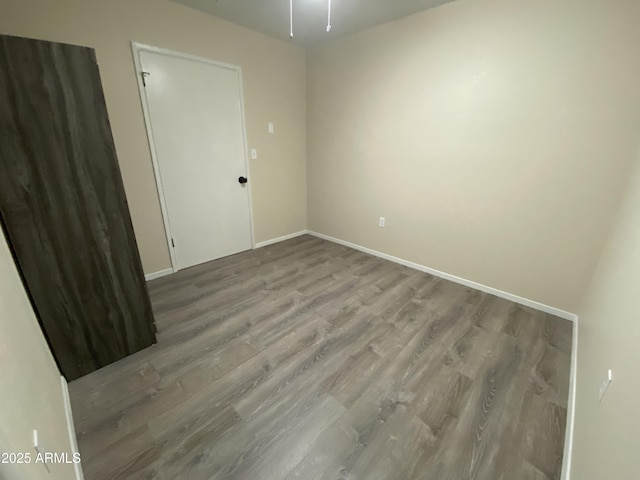 unfurnished room featuring wood-type flooring