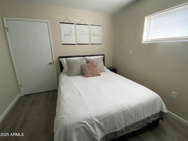 bedroom featuring dark wood-type flooring