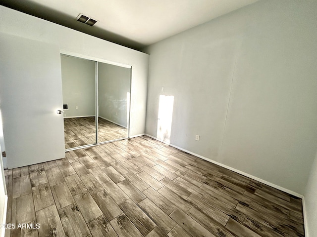 unfurnished bedroom featuring a closet