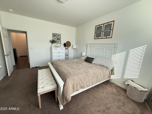 bedroom featuring carpet flooring and baseboards