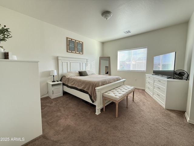 bedroom featuring carpet flooring and visible vents