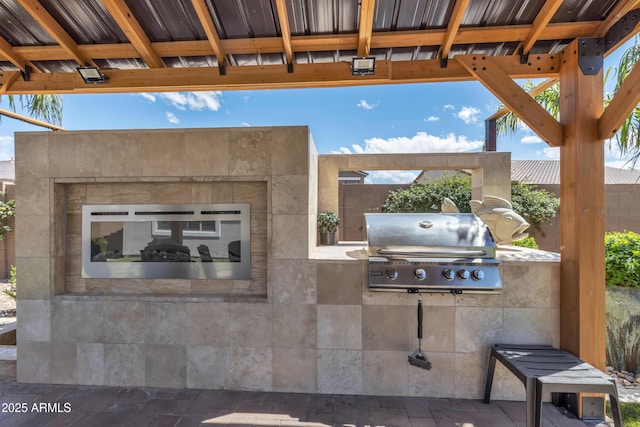 view of patio featuring exterior kitchen and area for grilling