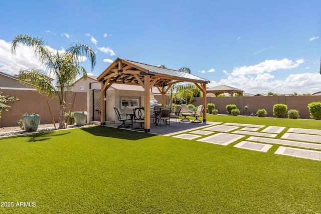 view of yard with a gazebo, a patio area, and a fenced backyard