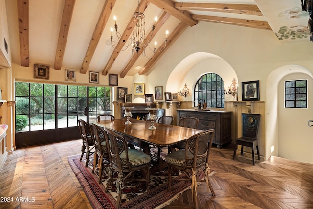 dining area featuring beam ceiling, a warm lit fireplace, and high vaulted ceiling