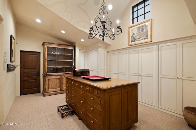 spacious closet featuring light carpet and vaulted ceiling