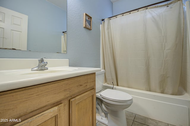 full bathroom featuring shower / tub combo, vanity, toilet, and tile patterned flooring