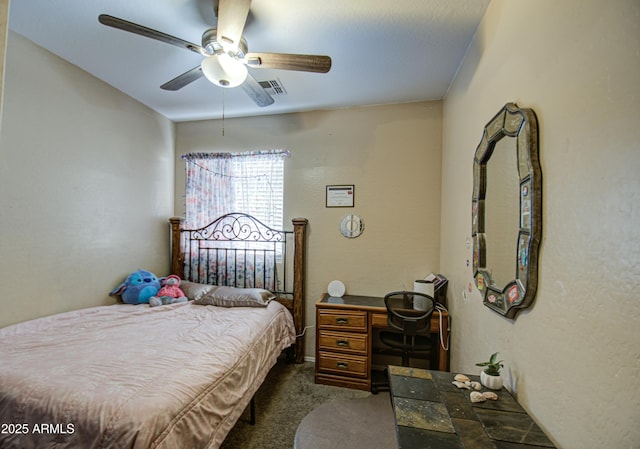 bedroom featuring ceiling fan and dark colored carpet