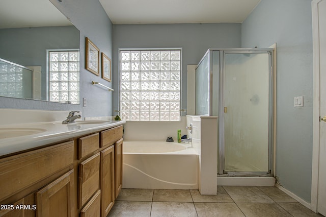 bathroom with tile patterned floors, plus walk in shower, and a wealth of natural light